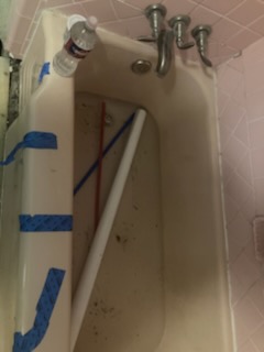 Installing a bathroom tub and faucet