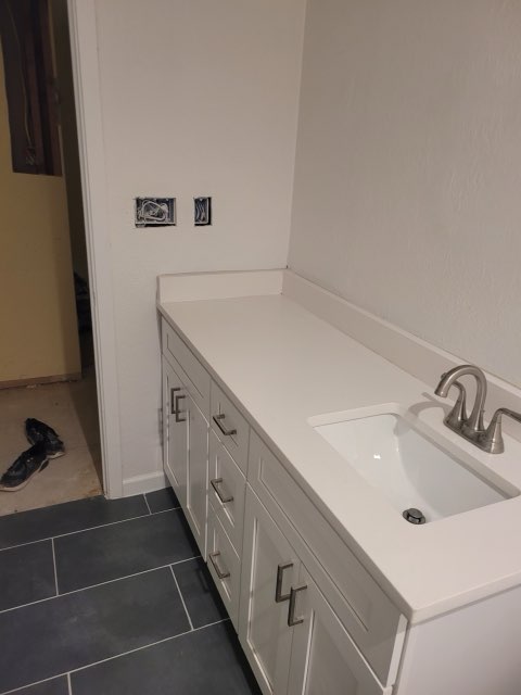Finished bathroom vanity with quartz countertop